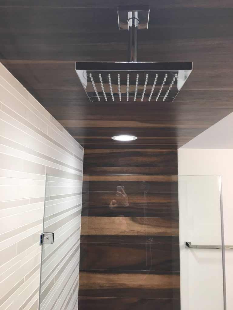 Rain shower with custom tile and glass enclosure
