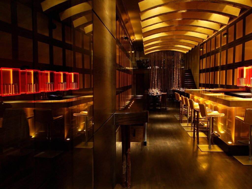 Modern bar renovation with custom lighting and seating by Jordan Guide Design