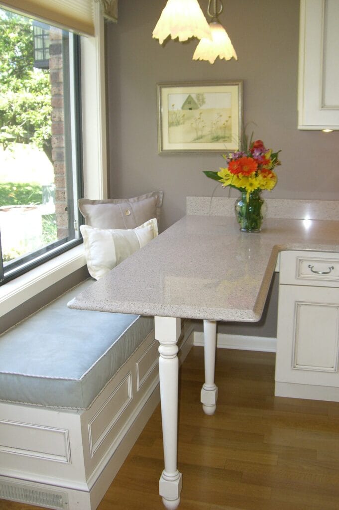 Universal design kitchen with wheelchair-accessible roll-under breakfast table and custom built-ins by Jordan Guide Design