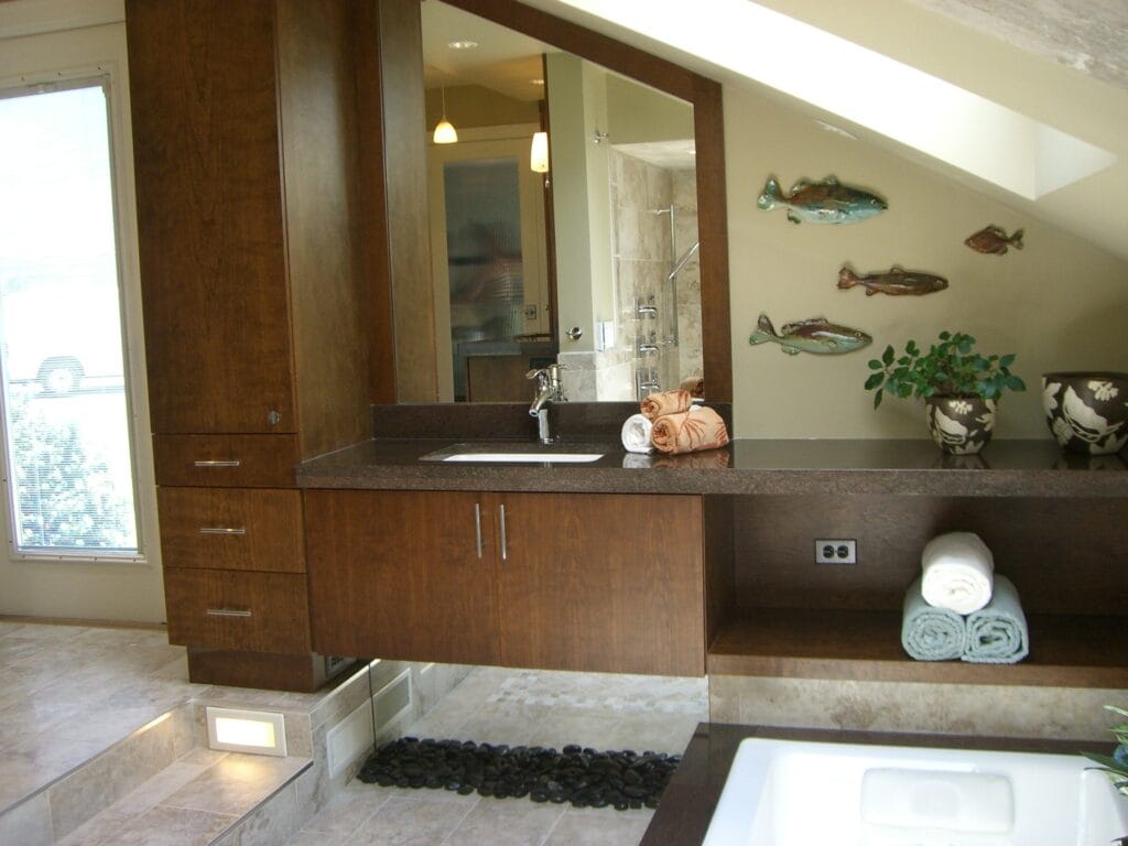 Zen master bathroom vanity with custom wood cabinetry stone tile flooring and spa-inspired design by Jordan Guide Design