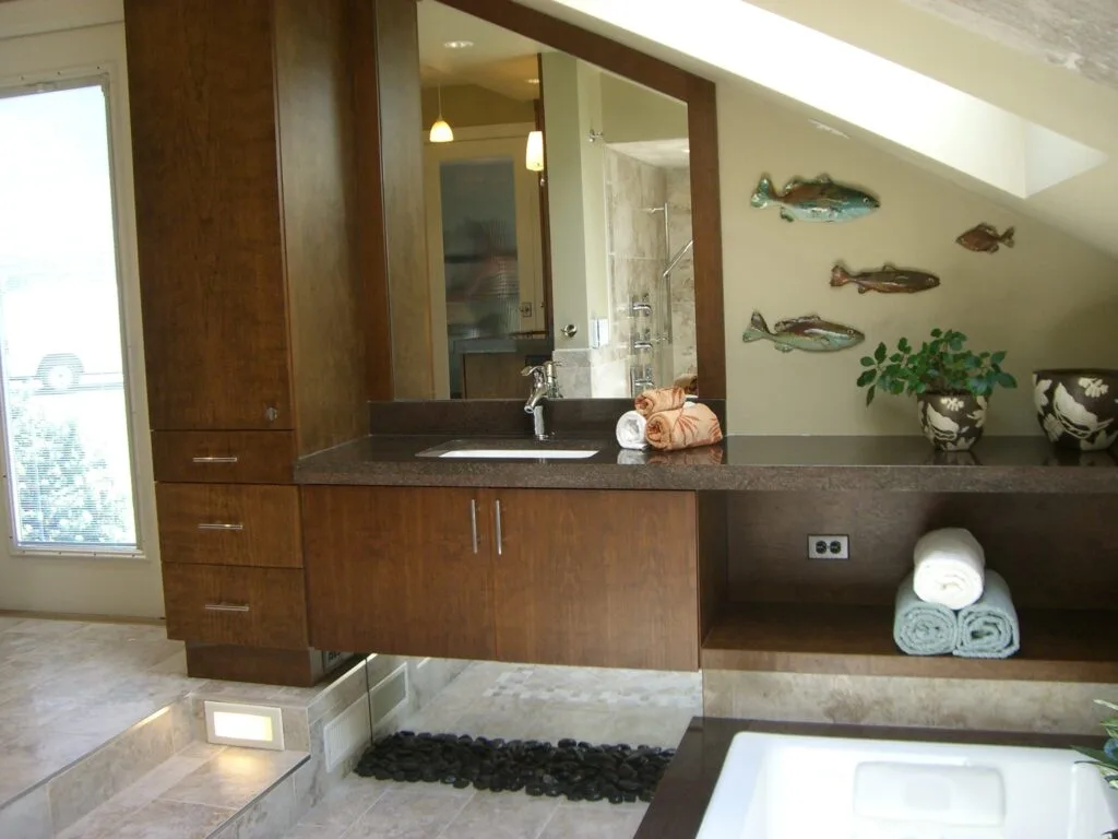 Zen master bathroom vanity with custom wood cabinetry stone tile flooring and spa-inspired design by Jordan Guide Design