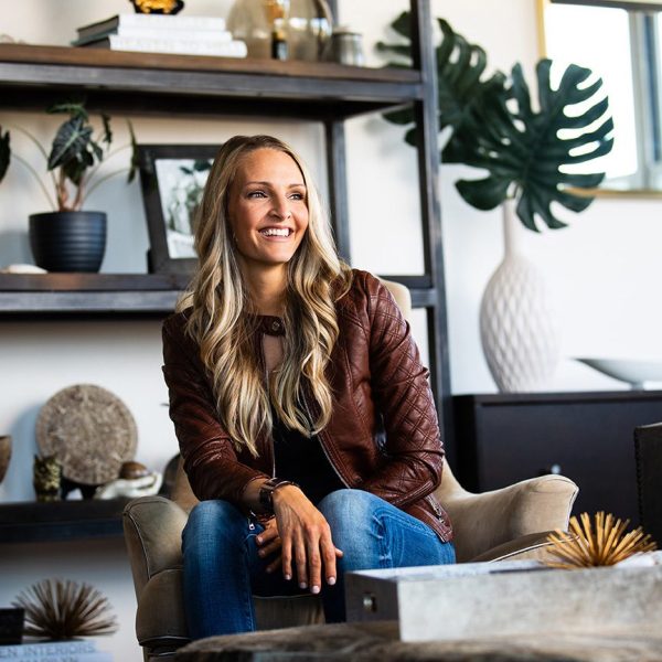 Jordan Guide, founder and interior designer of Jordan Guide Design, seated in a modern interior design studio in Naperville, IL