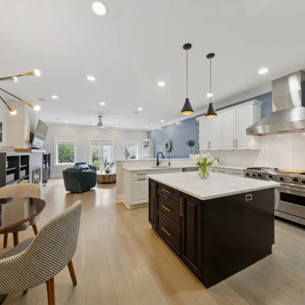 Open-concept whole house remodel with custom kitchen and dining area by Jordan Guide Design